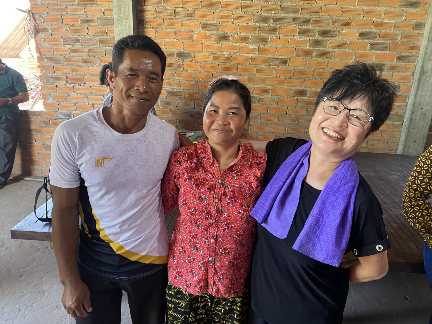 Prophet Soonhe Young with a Cambodian couple