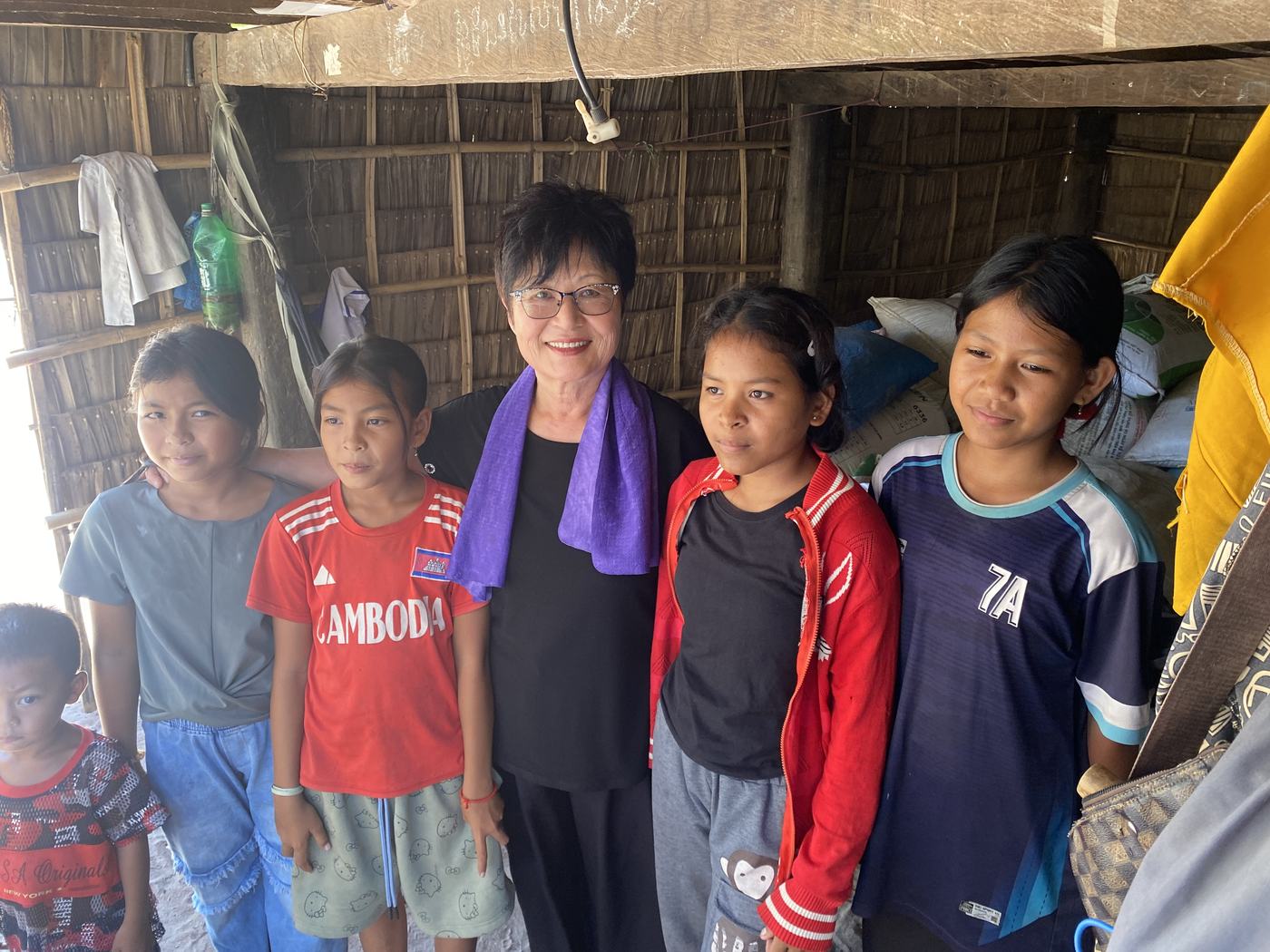 Prophet Soonhe Young with four girls in a village home in Cambodia